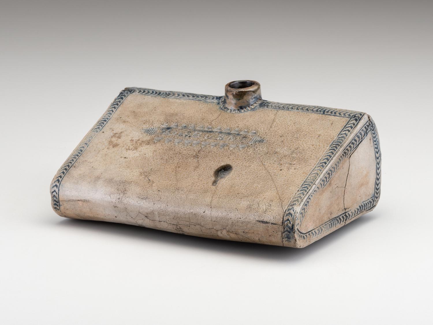 An Early Incised and Cobalt Decorated Stoneware Foot Warmer