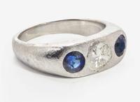 An 18K White Gold, Sapphire, and Diamond Three-Stone Ring