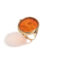 A Neoclassical Gold and Carnelian Finger Ring with the God Zeus, a Reclining Female, and a Greek Inscription