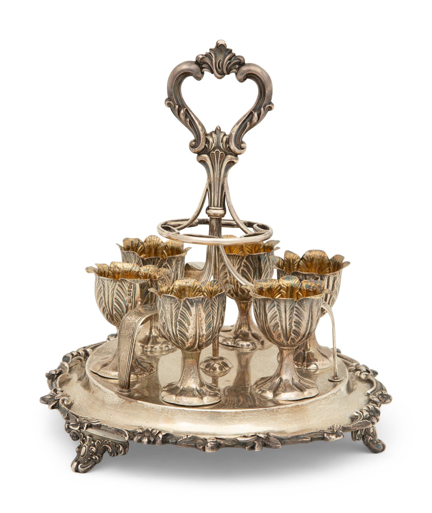 An English Silver Six-Egg Cruet and Footed Silver and Cobalt Glass Basket