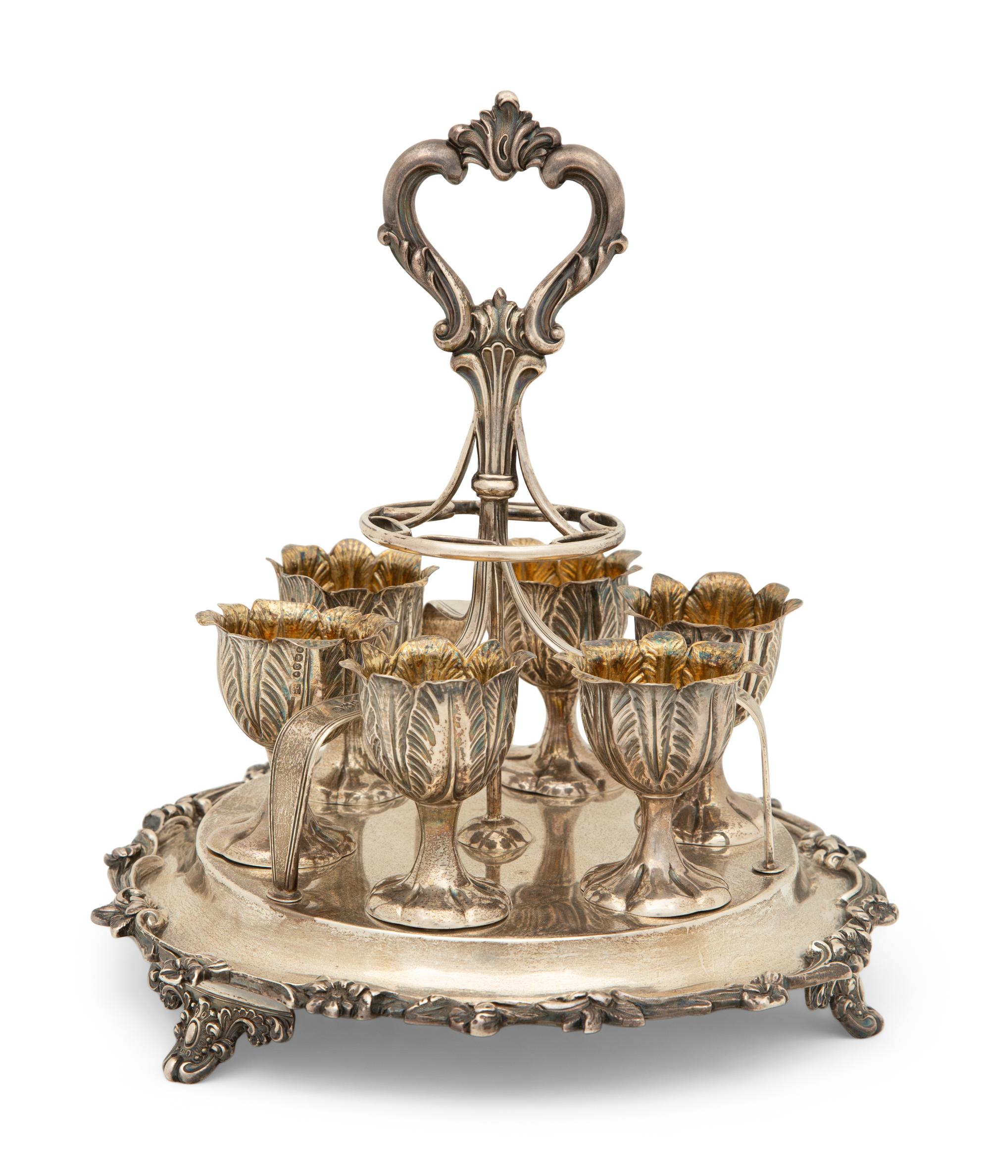 An English Silver Six-Egg Cruet and Footed Silver and Cobalt Glass Basket