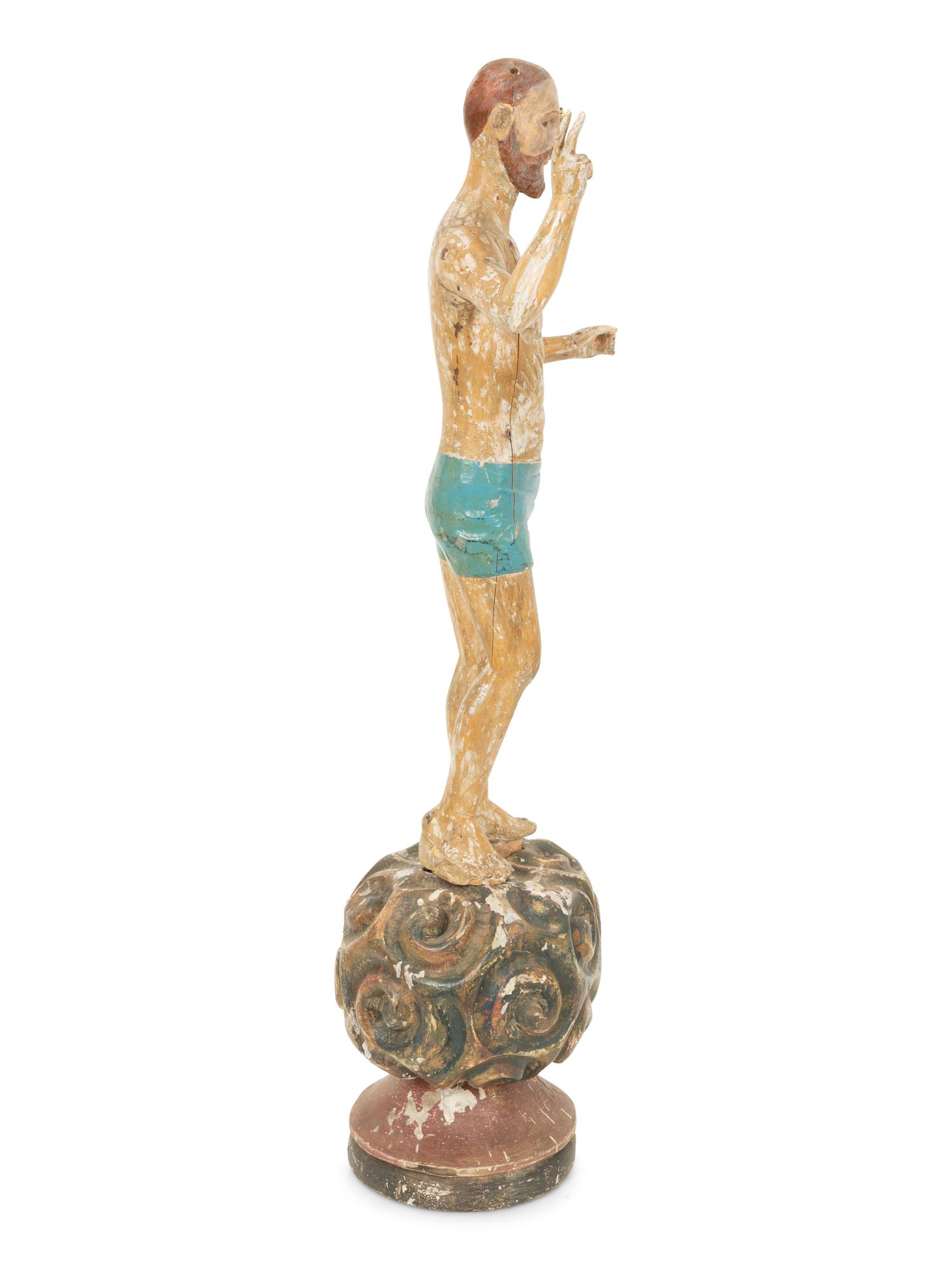An Italian Carved and Polychromed Giltwood Santos Figure