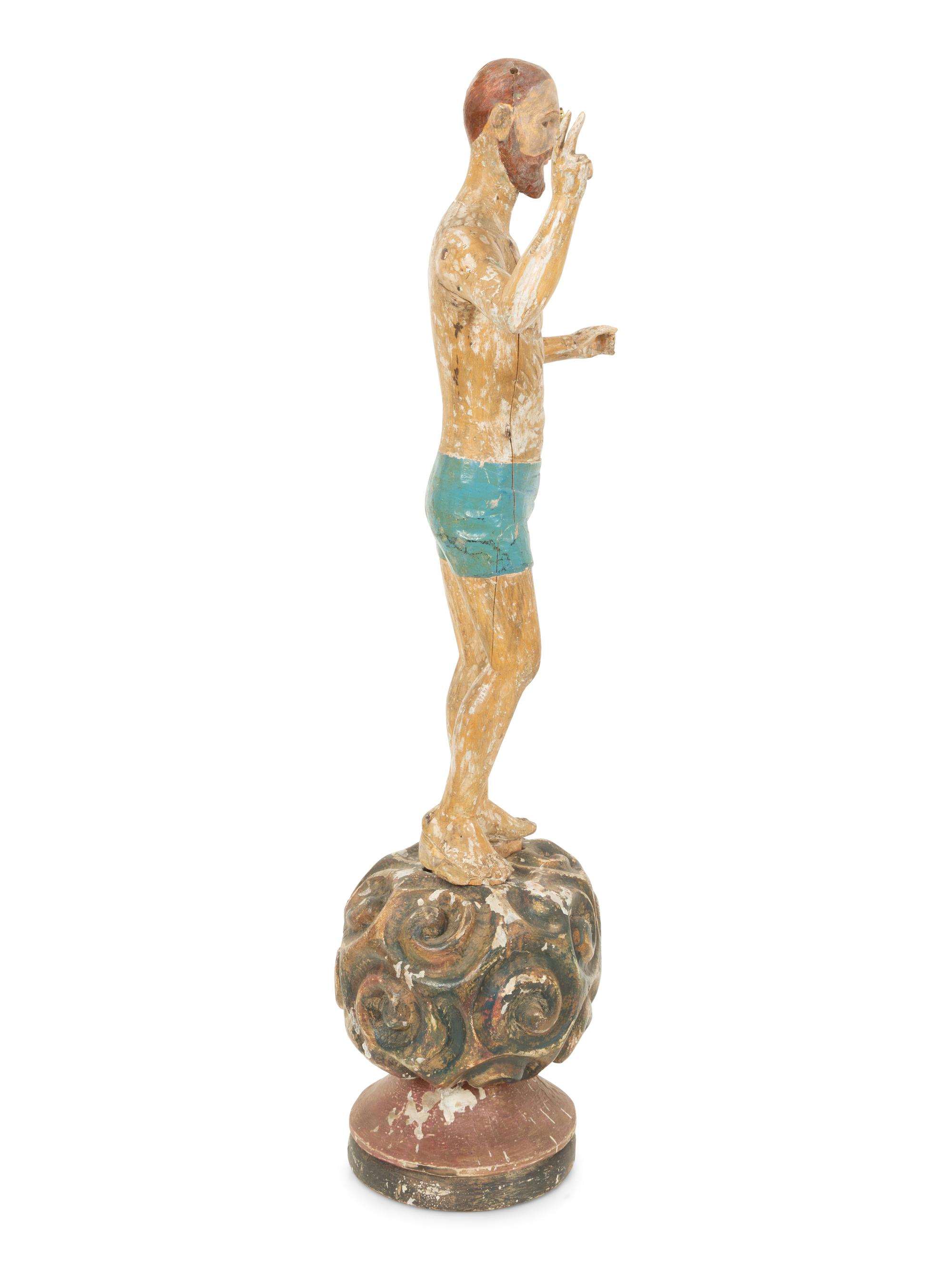 An Italian Carved and Polychromed Giltwood Santos Figure