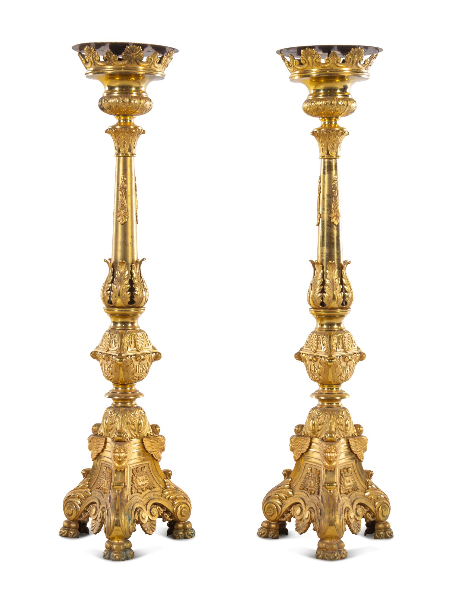 A Pair of Gilt Brass Altar Candlesticks with Associated Marble Tops
