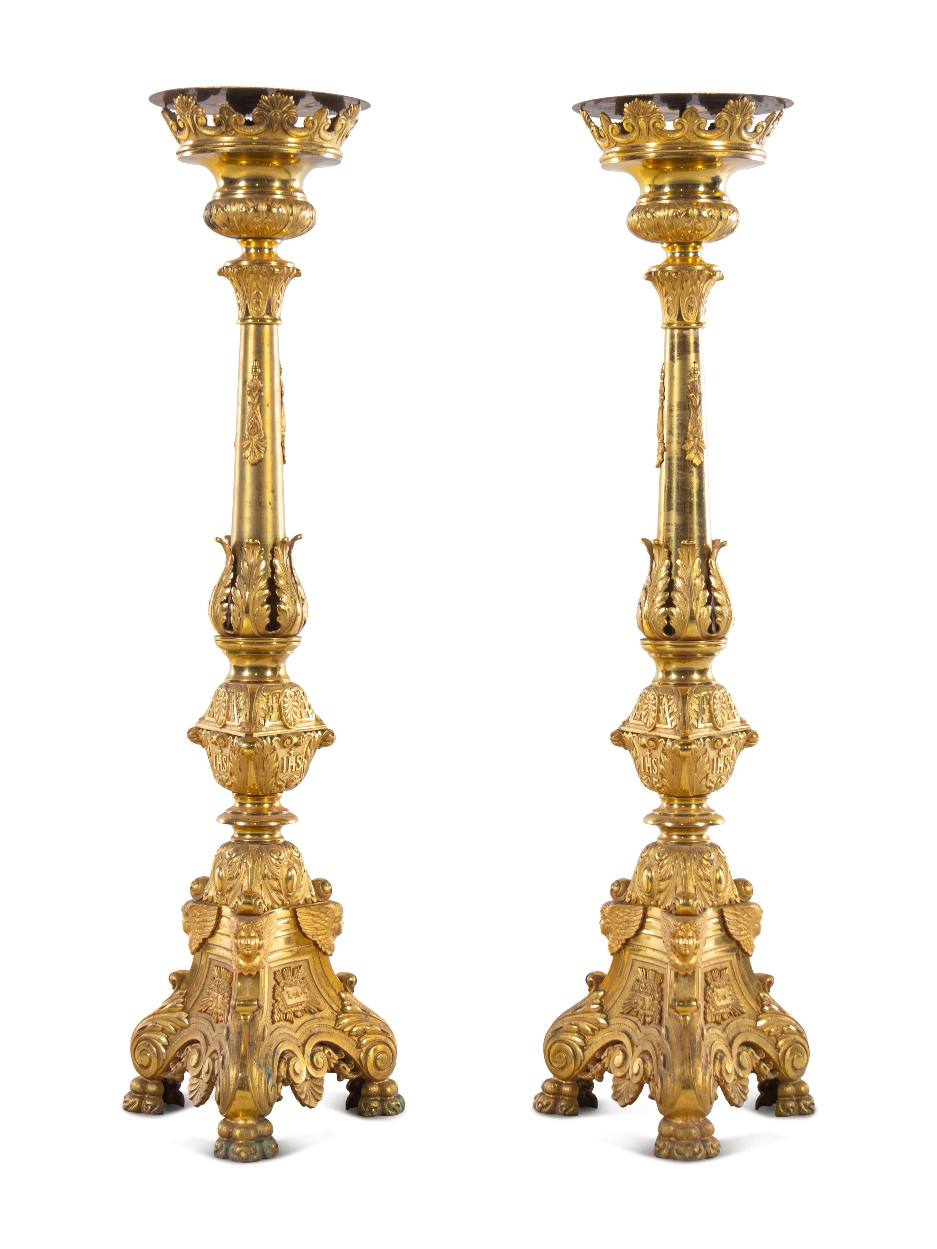 A Pair of Gilt Brass Altar Candlesticks with Associated Marble Tops