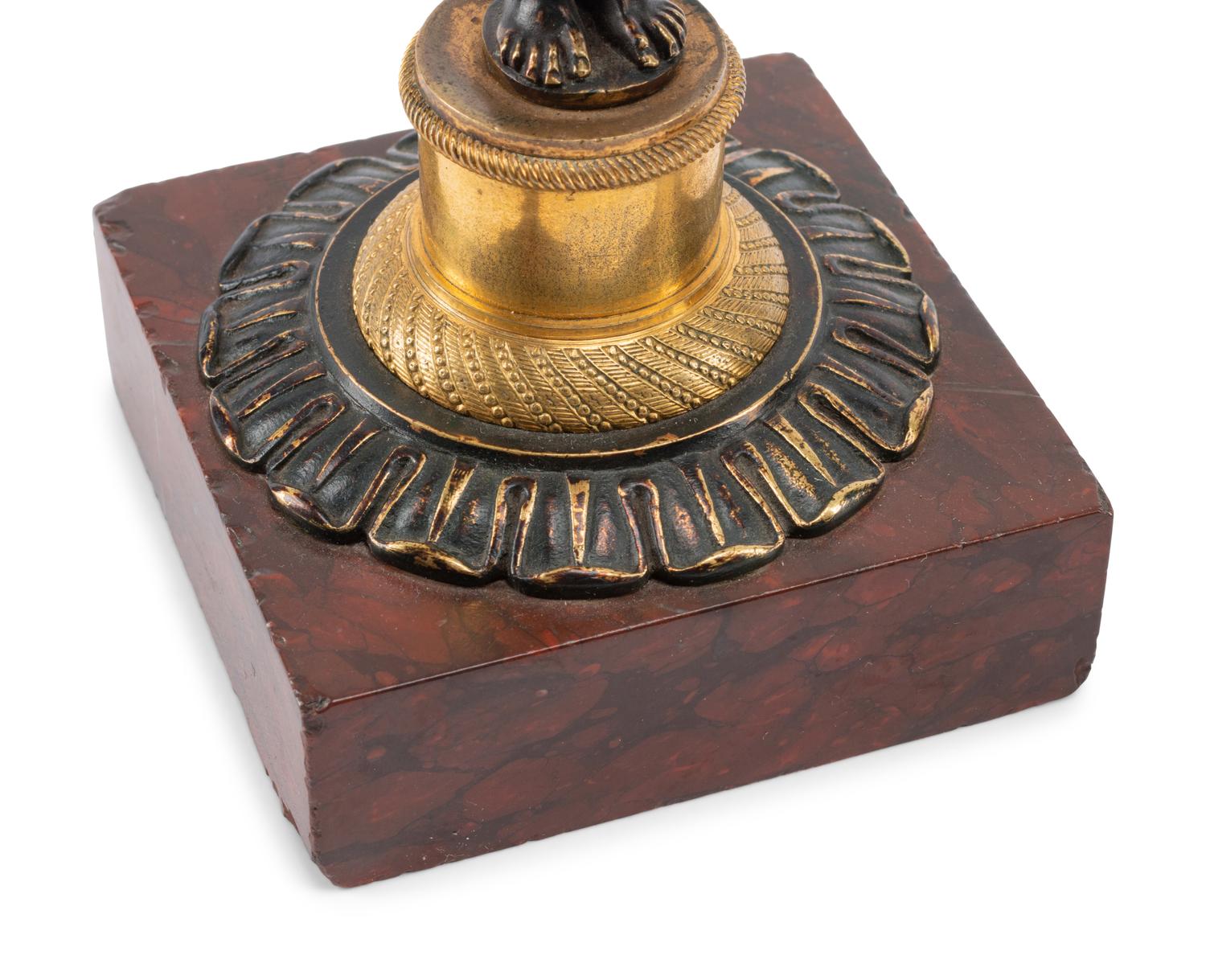 A Pair of French Gilt and Patinated Bronze and Marble Figural Candlesticks in the Form of Atlas