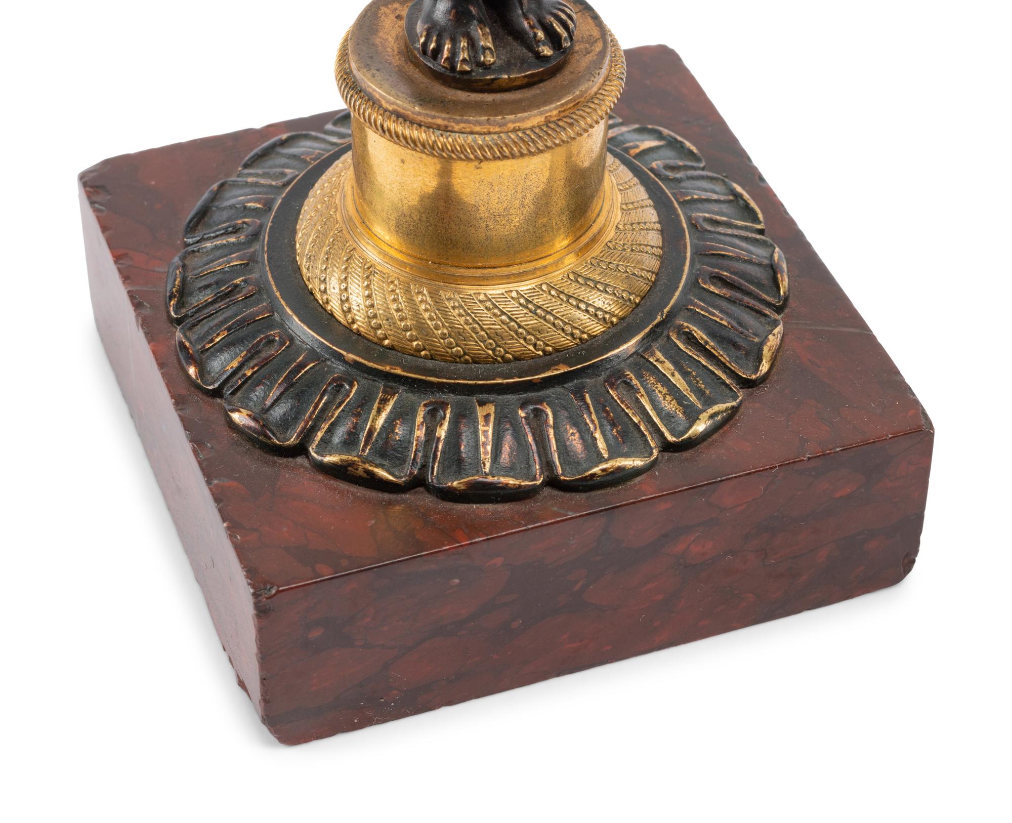 A Pair of French Gilt and Patinated Bronze and Marble Figural Candlesticks in the Form of Atlas