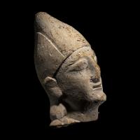 A Cypriot Limestone Votive Head