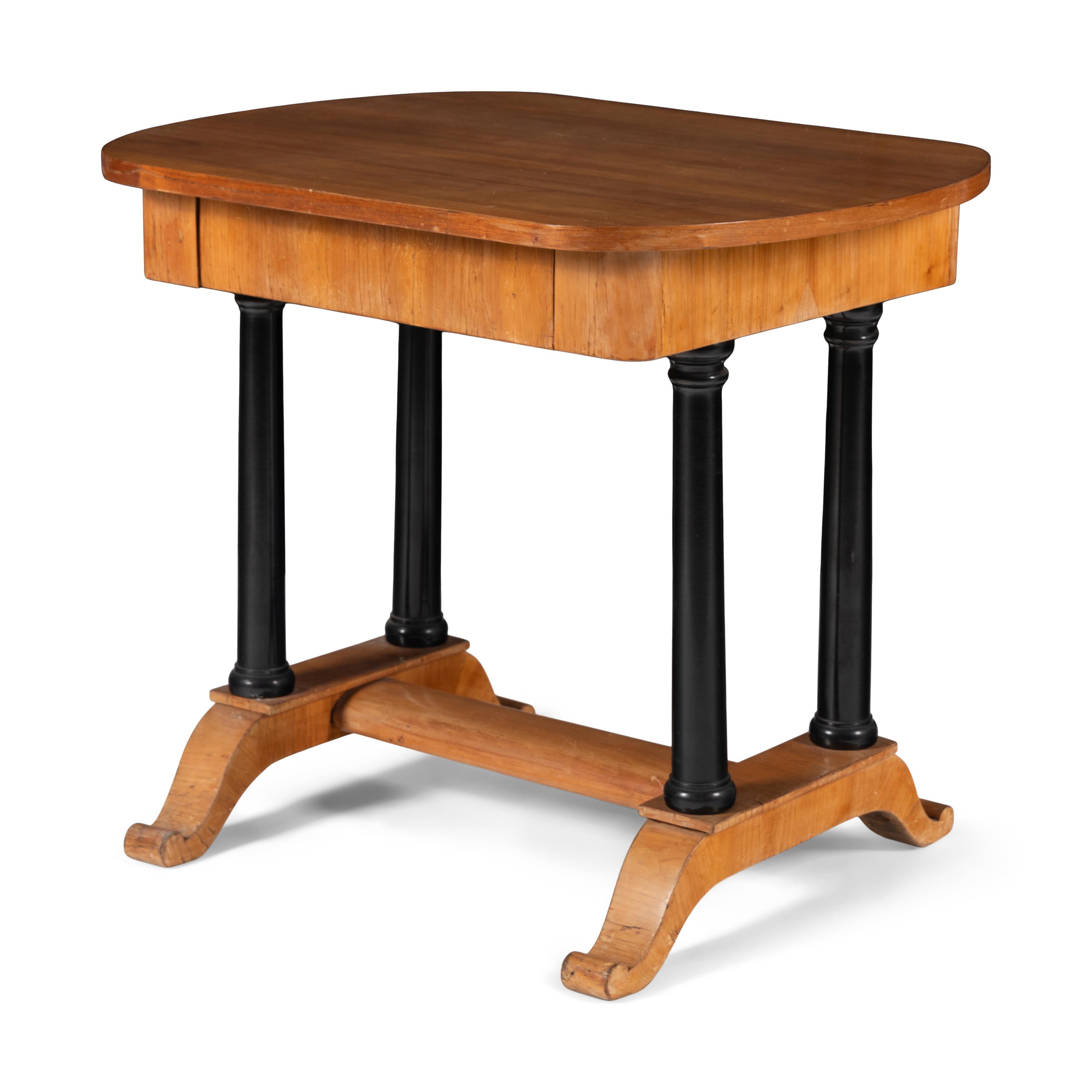 A Biedermeier Fruitwood and Part Ebonized Writing Table