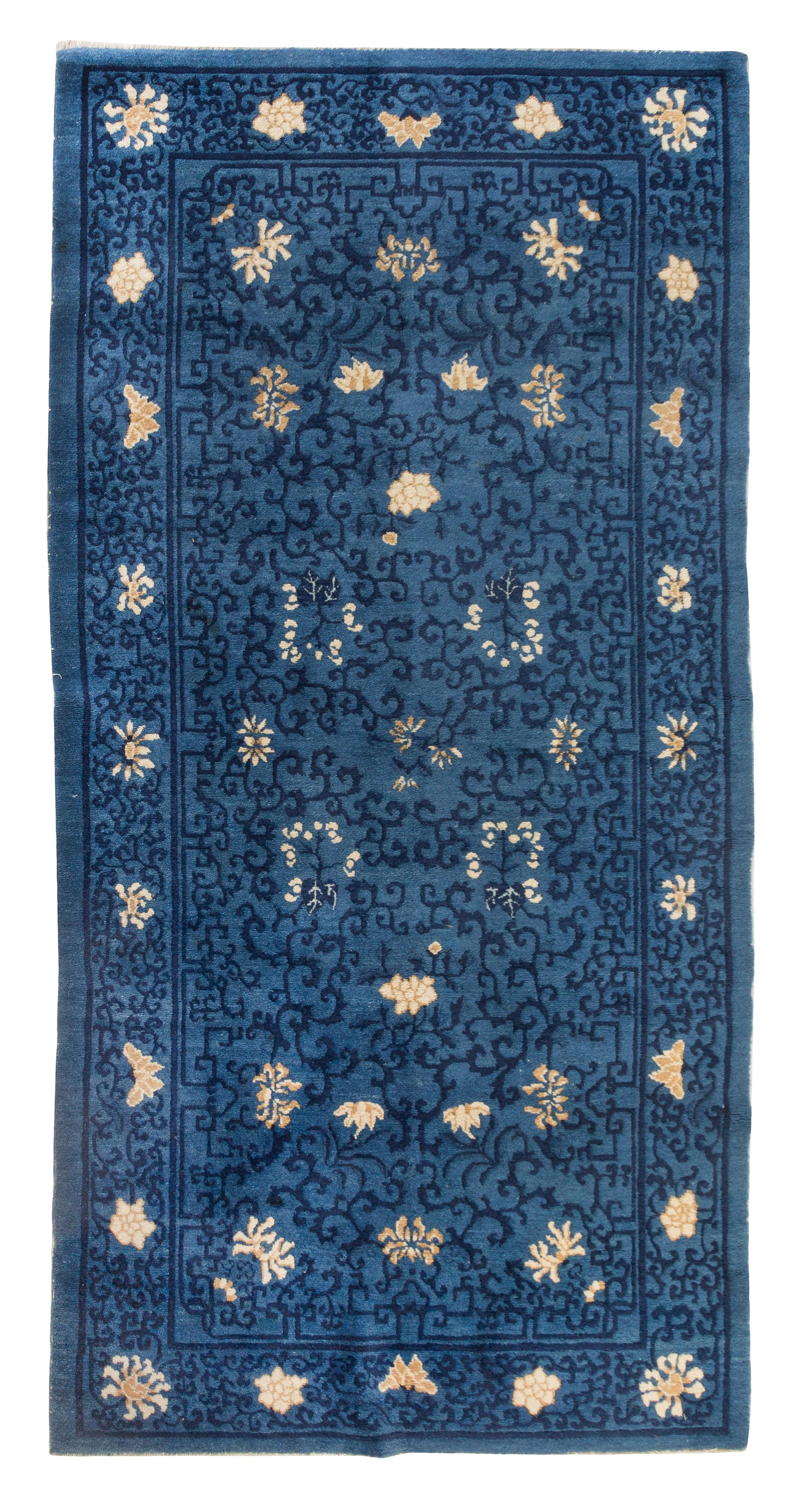 A Chinese Wool Rug Length 3 feet 1 inch x width 5 feet 9 3/4 inches.
