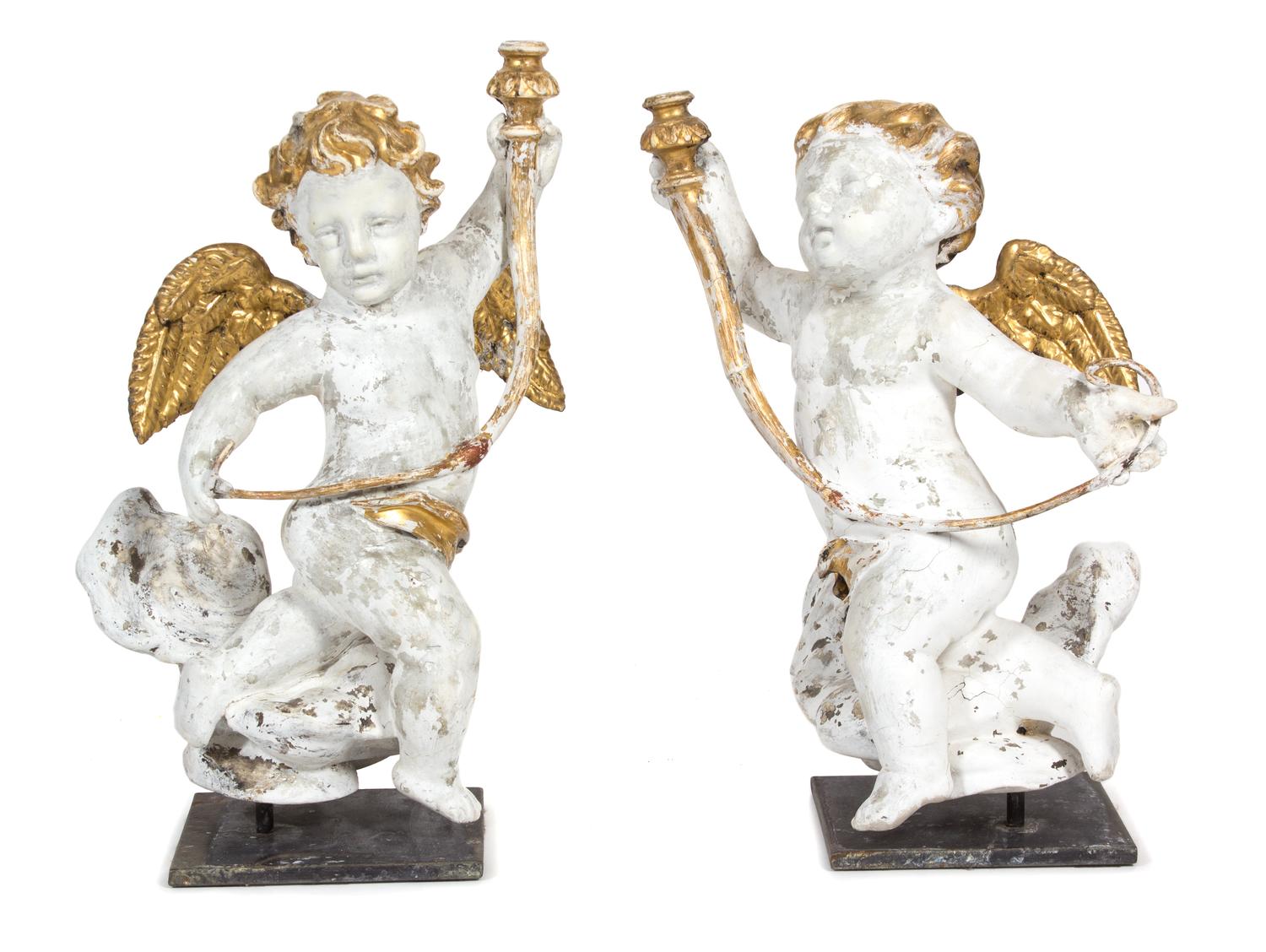 A Pair of Italian Carved Painted, and Parcel Gilt Putti Single Light Candelabra Height 22 3/4 x width 13 x depth 13 inches. — 18TH CENTURY