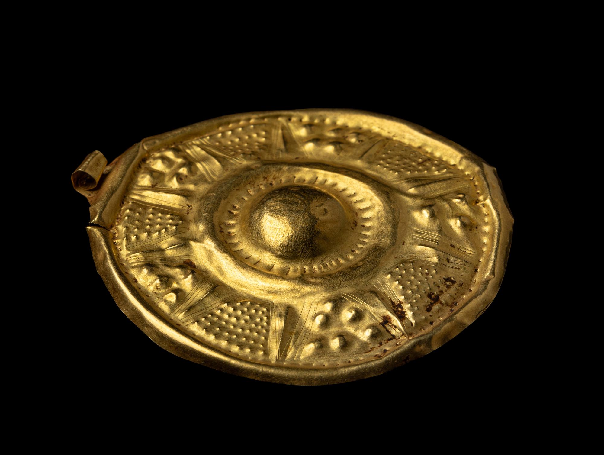 A Near Eastern Gold Disk Pendant