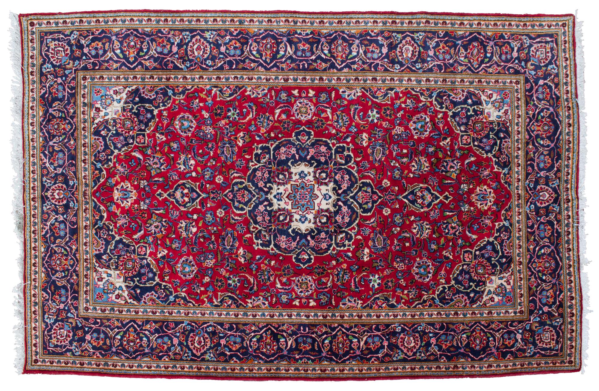 A Tabriz Wool Rug 9 feet 11 inches x 6 feet 7 1/2 inches.