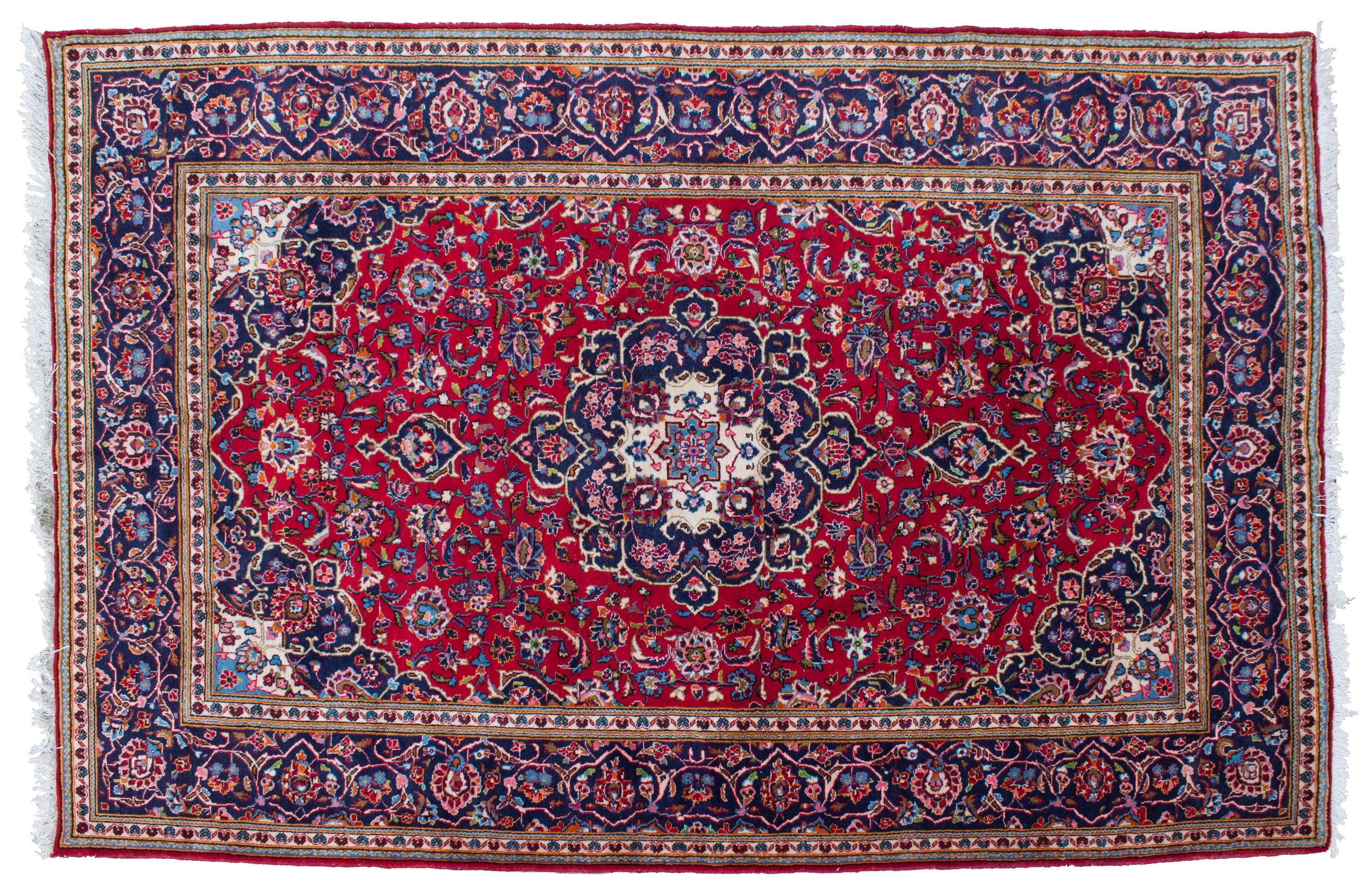 A Tabriz Wool Rug 9 feet 11 inches x 6 feet 7 1/2 inches.