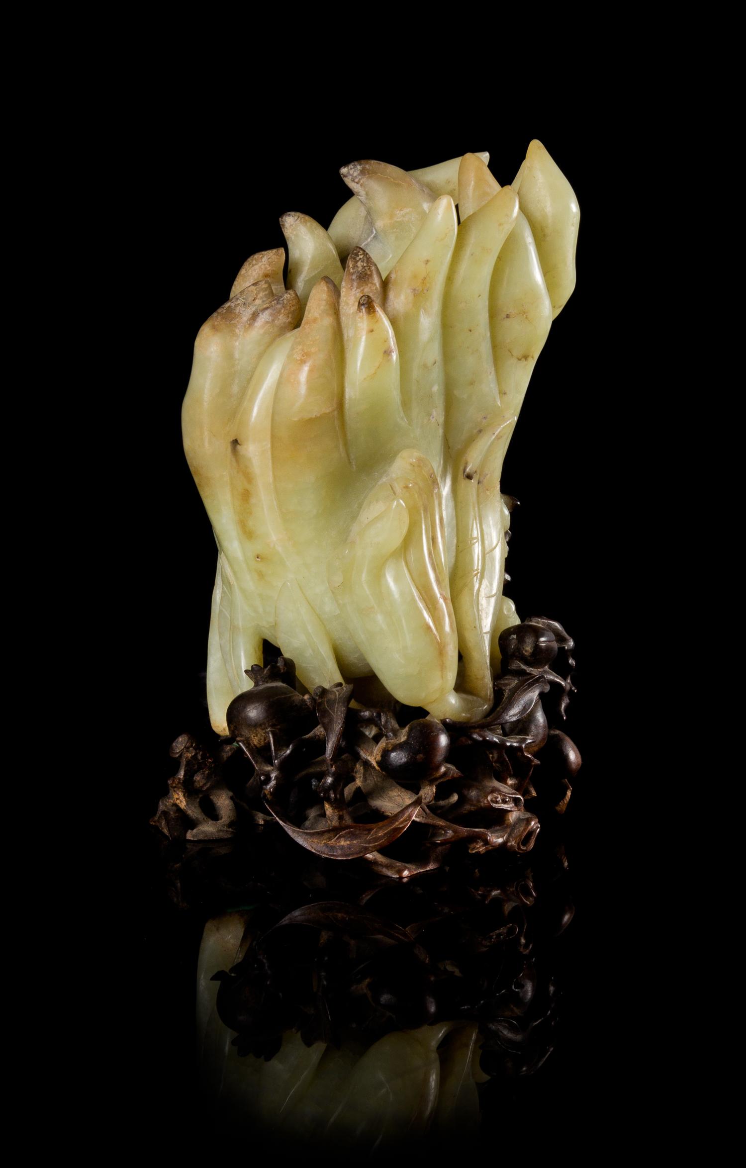A Celadon and Russet Jade Buddha's Hand Citron Vase Height 5 inches. — 18TH/19TH CENTURY
