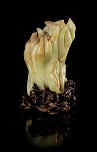 A Celadon and Russet Jade Buddha's Hand Citron Vase Height 5 inches. — 18TH/19TH CENTURY