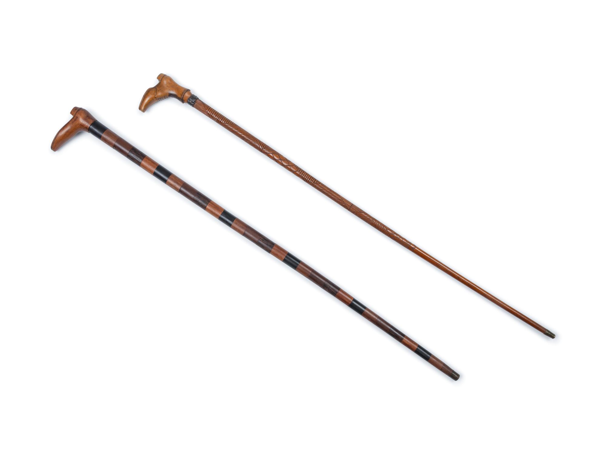 Two English Carved Wood Shoe-Form Canes