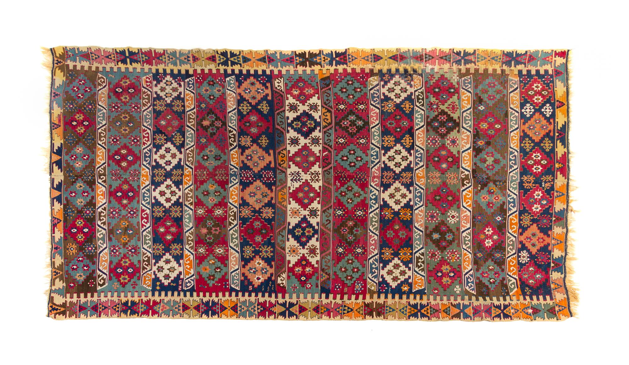 A Turkish Kilim Wool Rug 10 feet 6 inches x 6 feet 4 inches. — CIRCA 1880