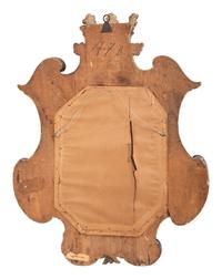 A Continental Carved, Painted and Parcel Gilt Mirror