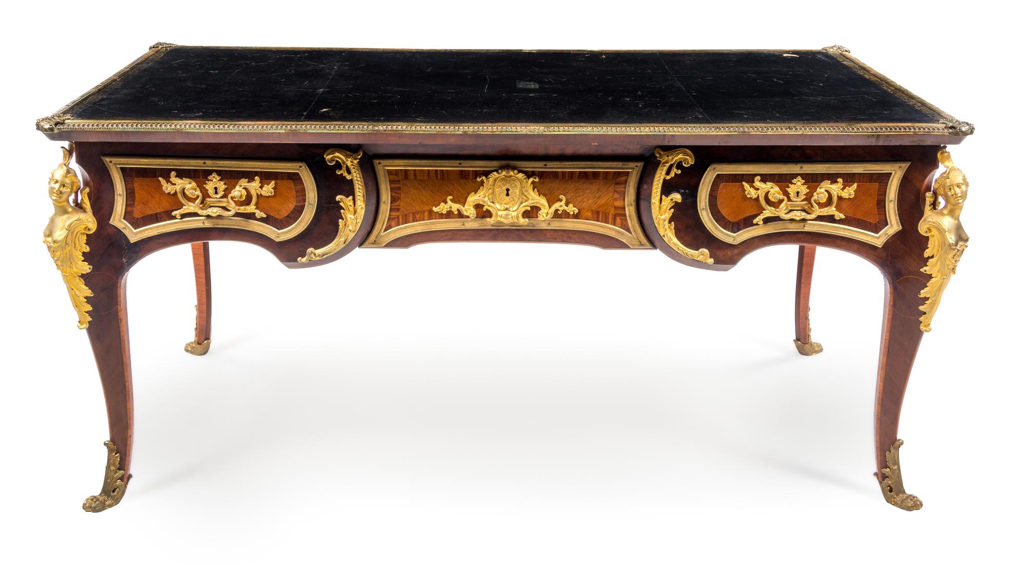 A Louis XV Style Gilt Bronze Mounted Bureau Plat Height 33 x width 70 x depth 37 inches. — AFTER THE MODEL BY CHARLES CRESSENT, EARLY 20TH CENTURY