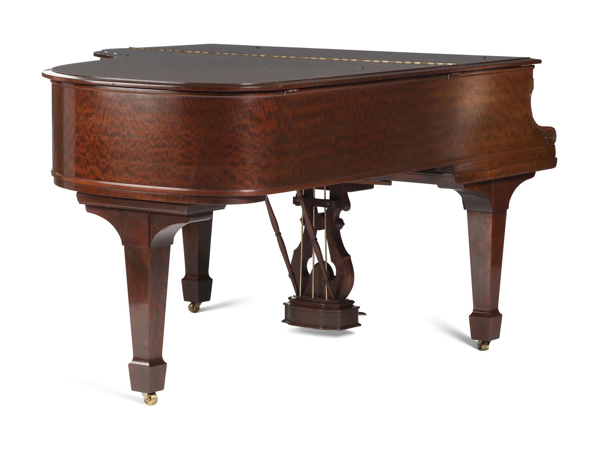 A Steinway and Sons Mahogany Baby Grand Piano