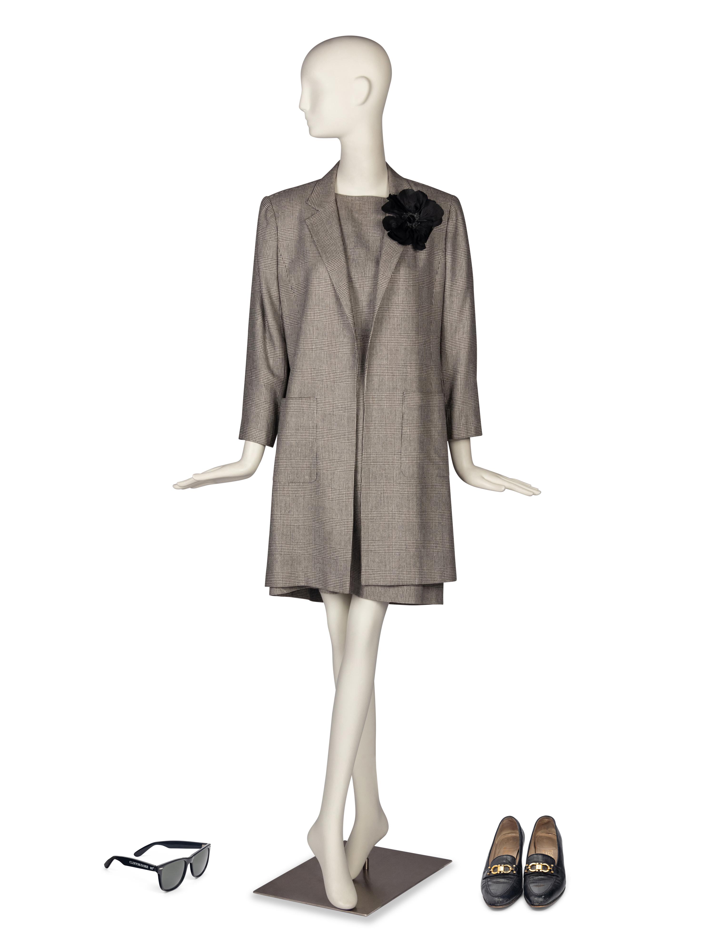 A Custom Glen Plaid Two Piece Suit, Salvatore Ferragamo Shoes, A Pair of Clinton-Gore Sunglasses, and Black Floral Brooch