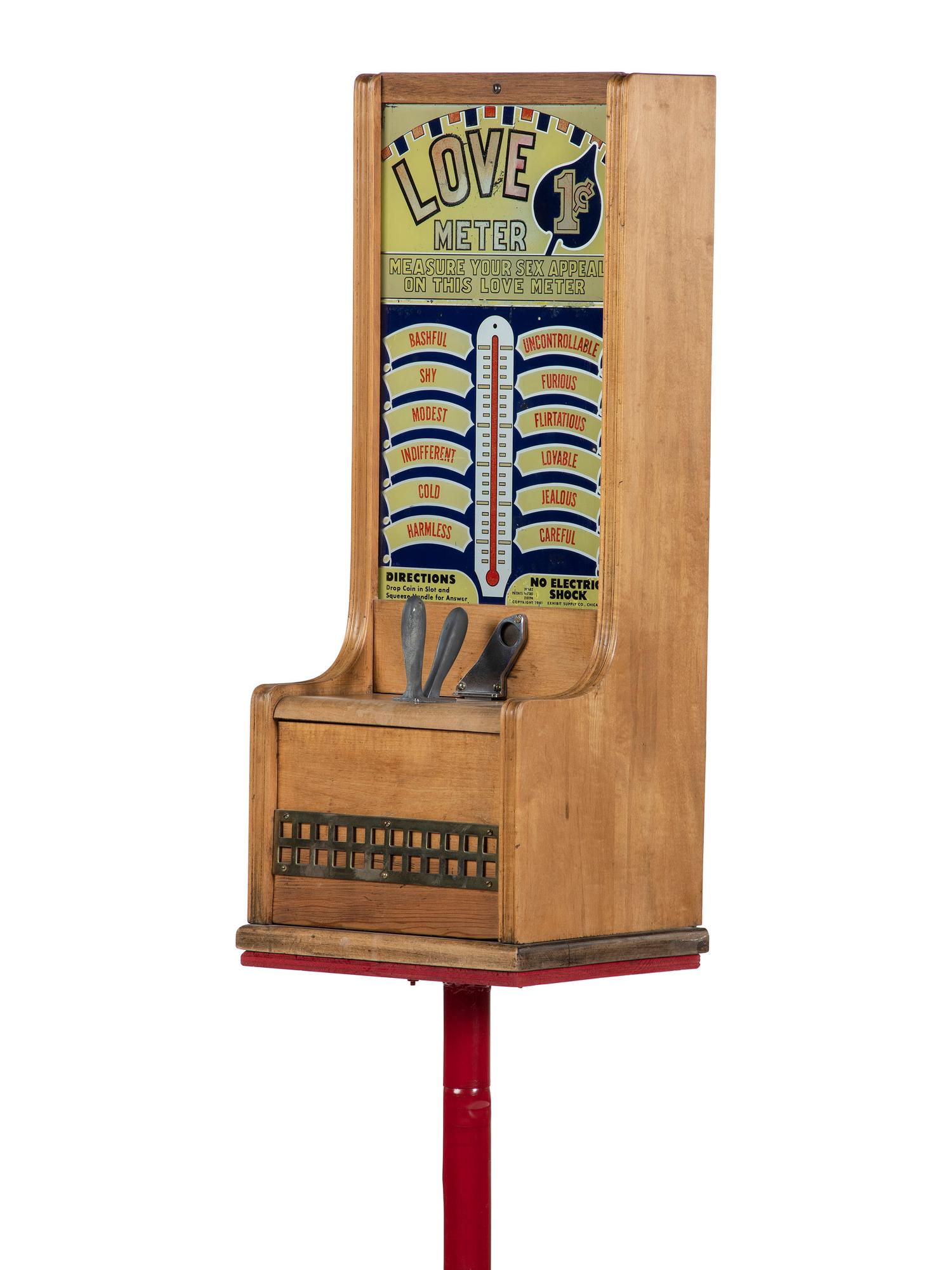 An Exhibit Supply Co. 1 Cent Love Meter on Stand