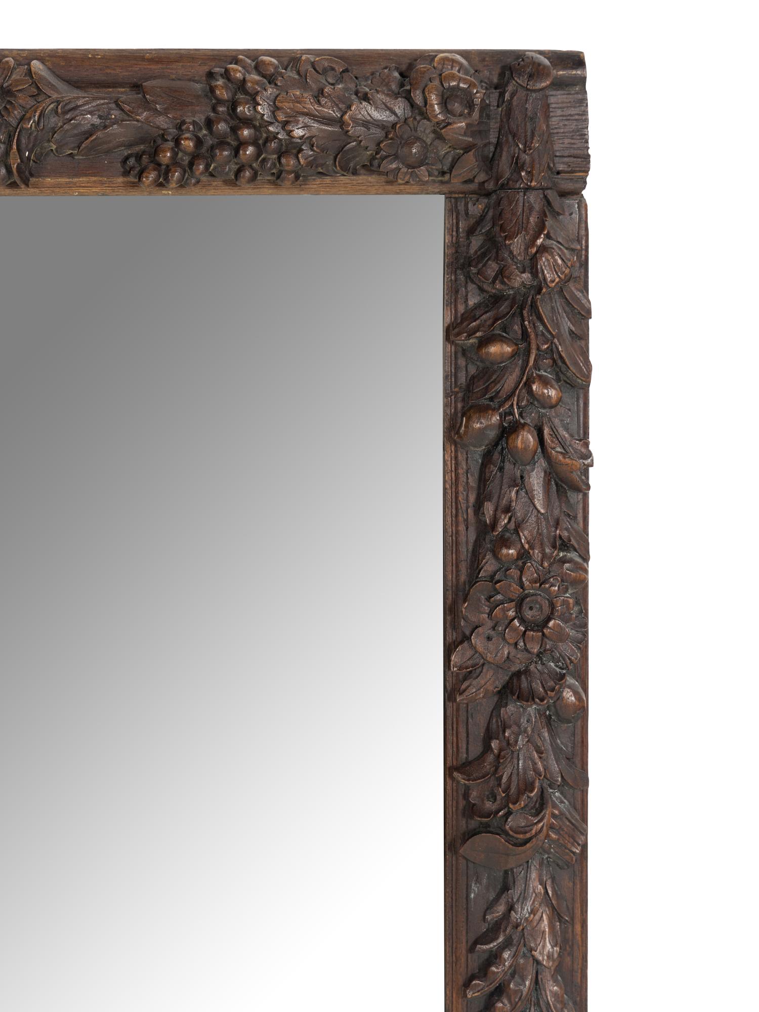 A Carved Oak Grapevine Motif Mirror