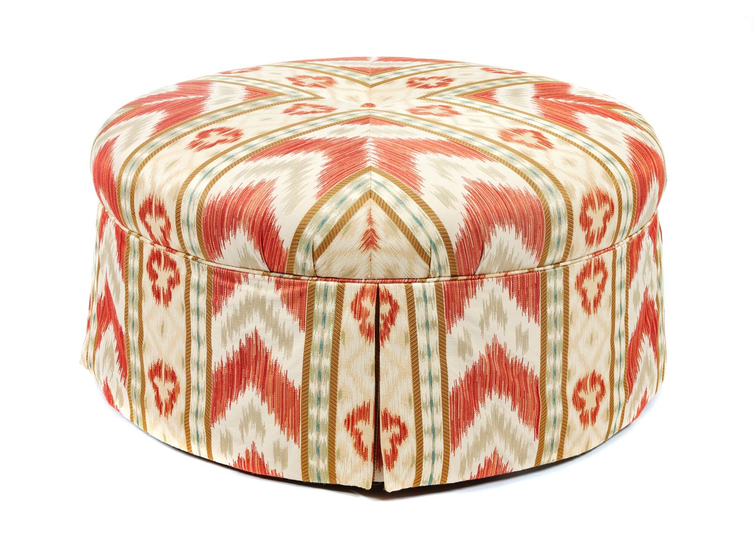 A Modern Ikat Upholstered Ottoman Height 18 x diameter 36 1/2 inches.