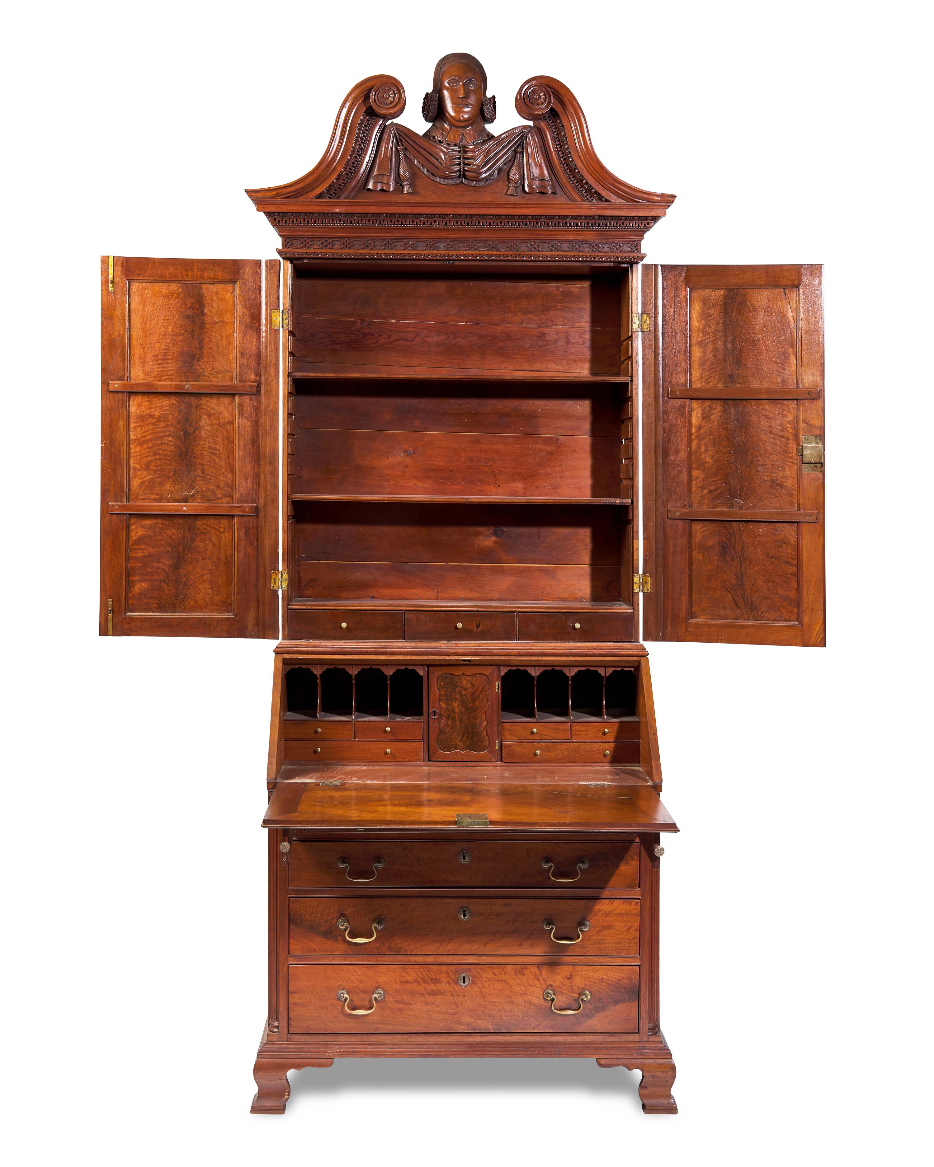 A Chippendale Carved Walnut Desk And Bookcase