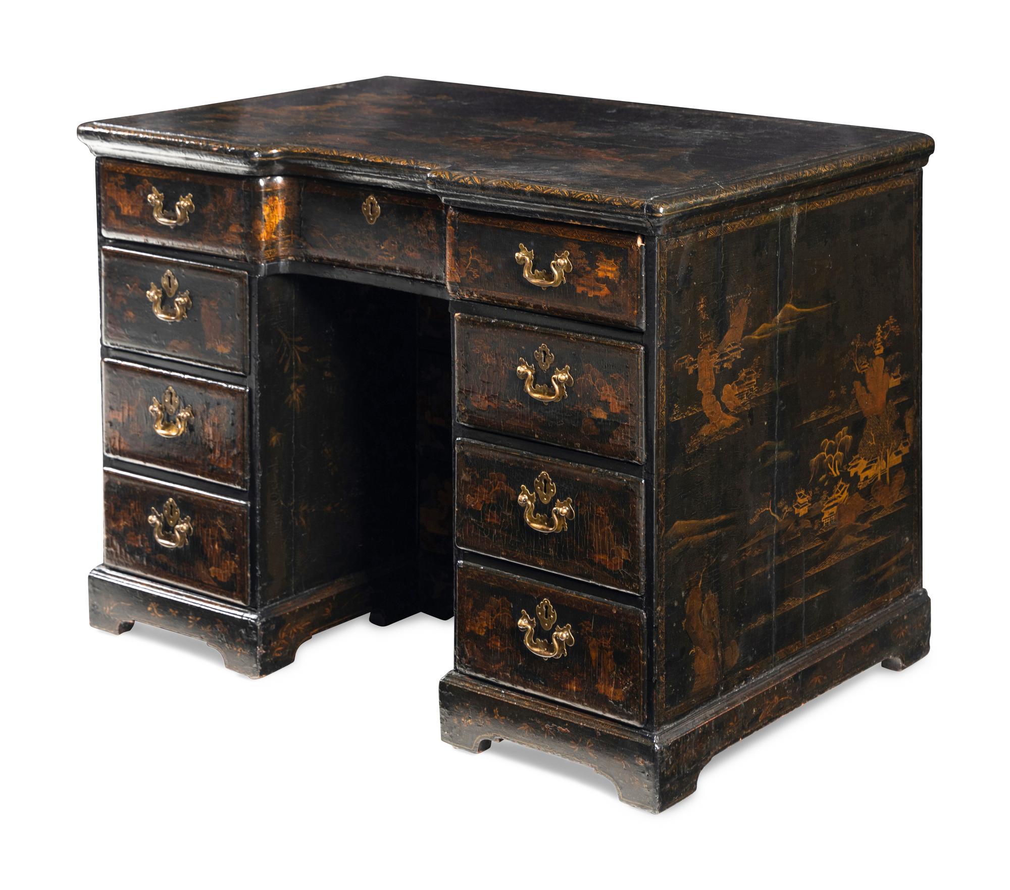 A Chinese Export Black and Gilt Lacquered Kneehole Desk