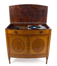 An Edwardian Marquetry Bowfront Cabinet Height 40 x width 41 x depth 21 inches. — 19TH/20TH CENTURY
