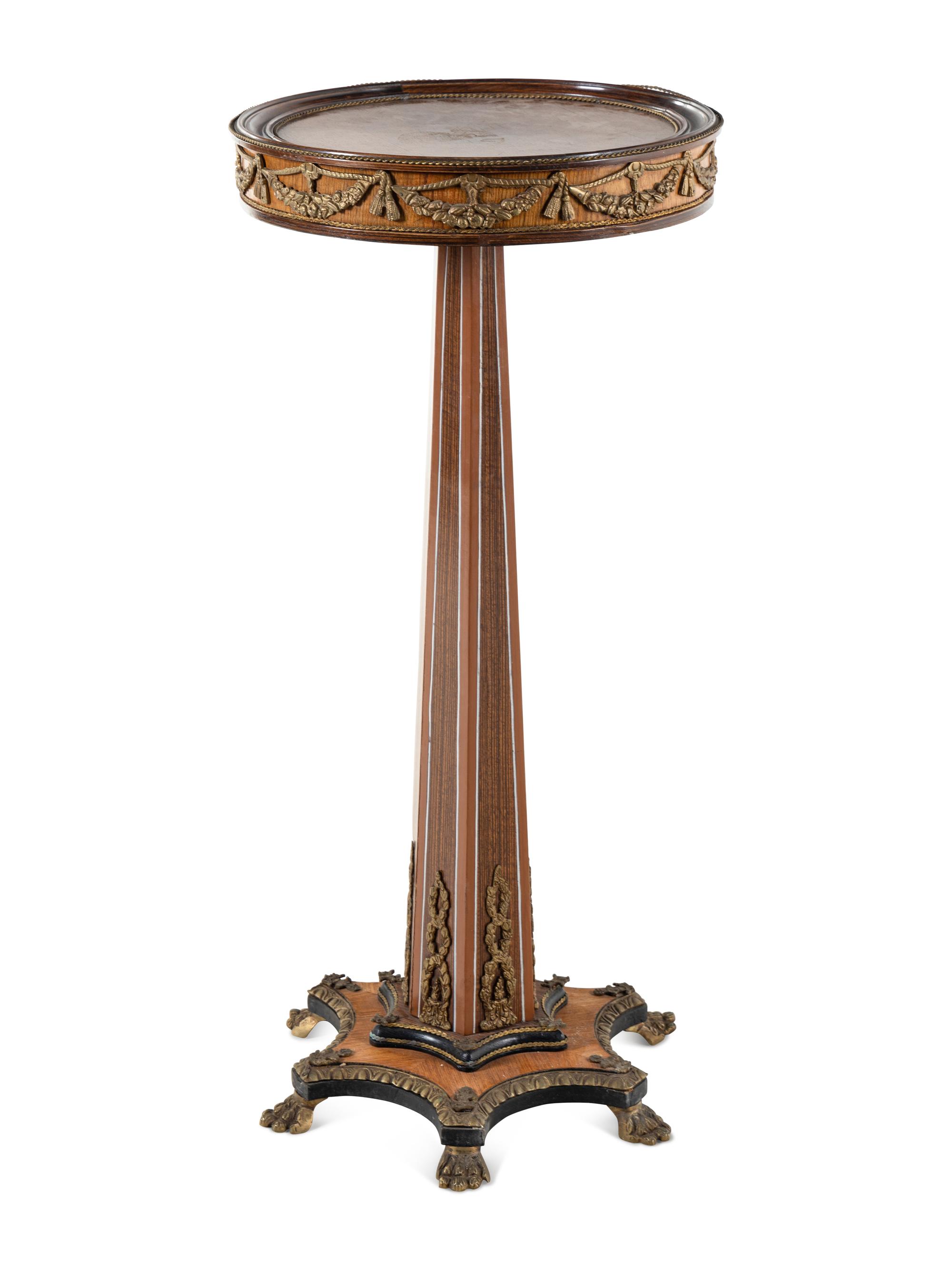 An Empire Style Gilt Metal Mounted Fruitwood Pedestal Table