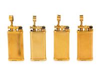 A Group of Four Gilt Metal Dunhill Lift-Arm Lighters