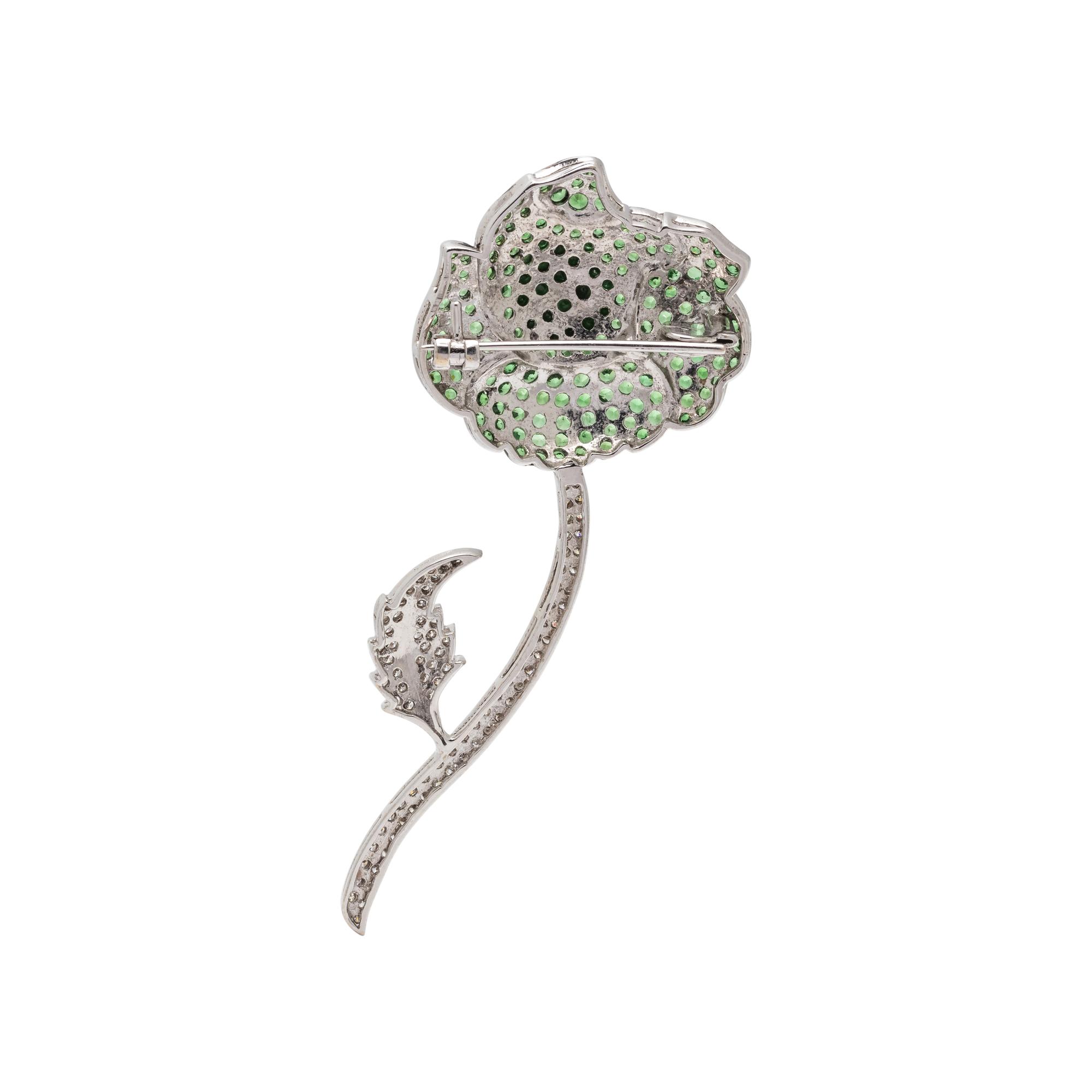 TSAVORITE GARNET AND DIAMOND FLOWER BROOCH
