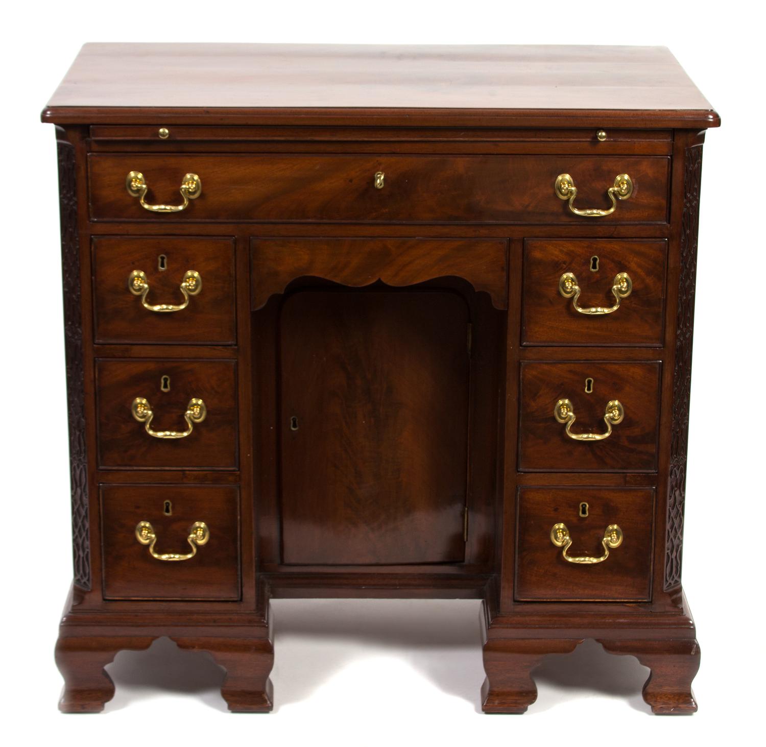 A George III Carved Mahogany Kneehole Desk Height 33 x width 34 x depth 19 inches. — 19TH CENTURY
