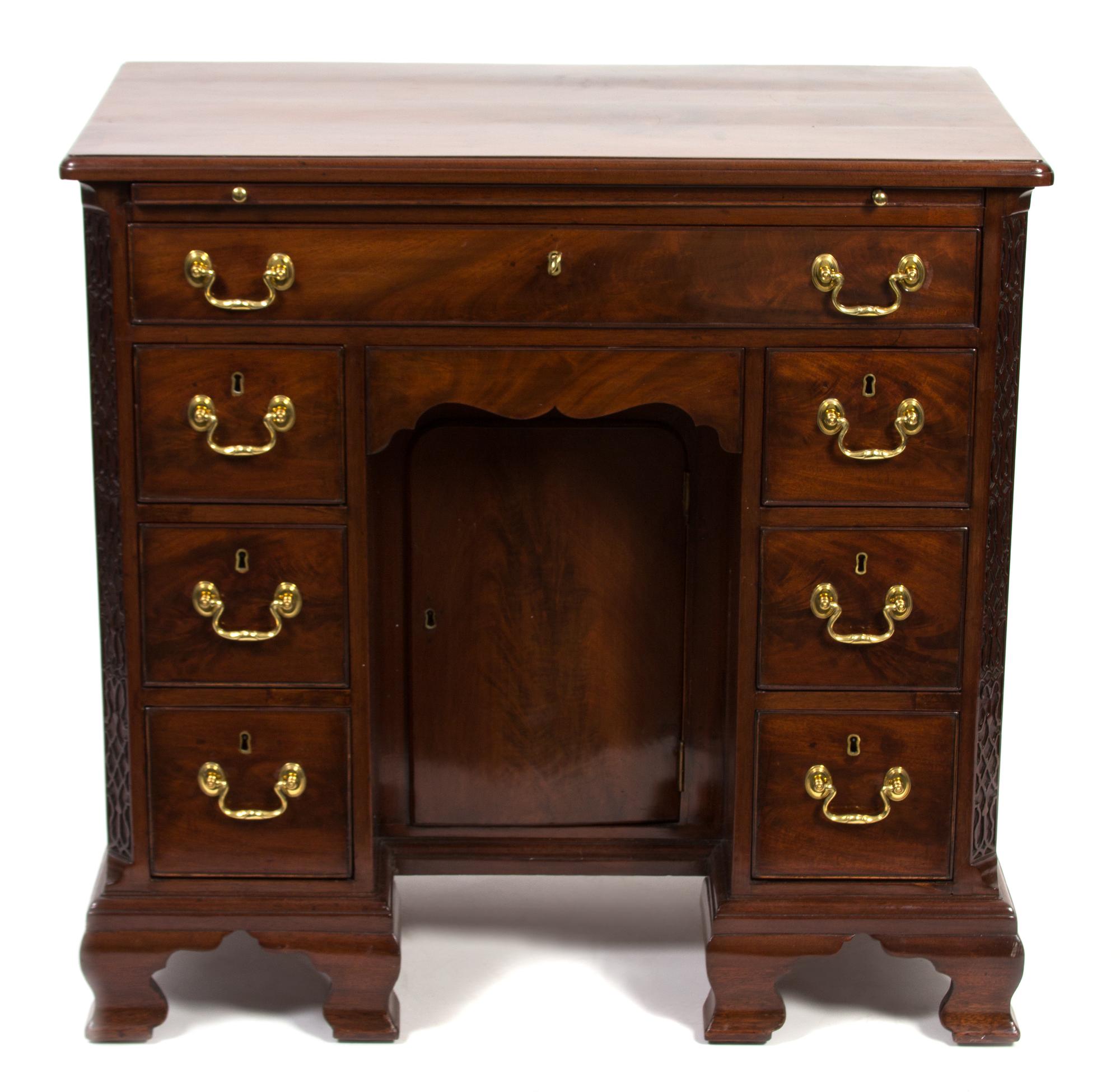 A George III Carved Mahogany Kneehole Desk Height 33 x width 34 x depth 19 inches. — 19TH CENTURY