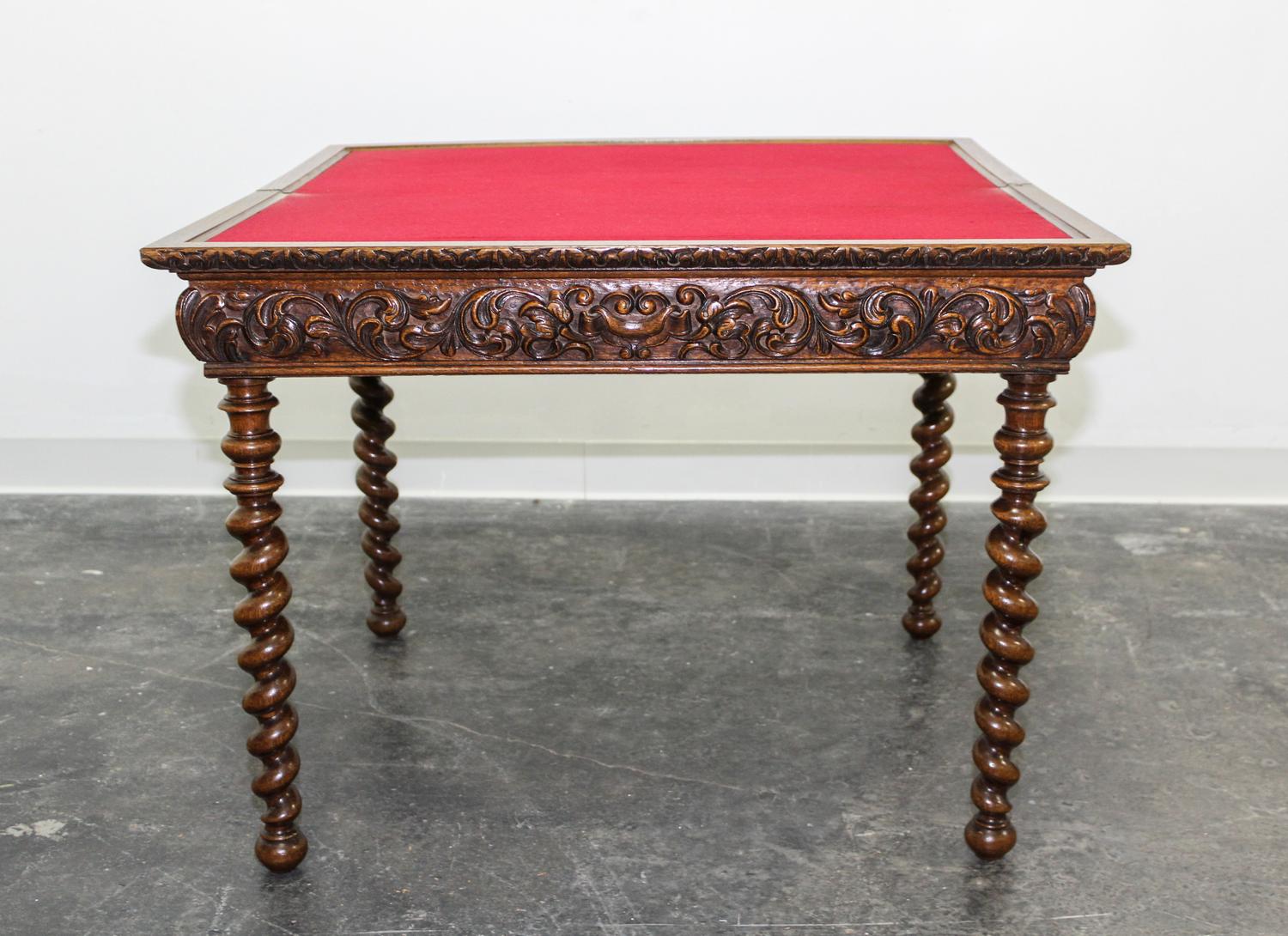 A Jacobean Revival Style Flip Top Games Table. Height 26 1/4 x width 34 1/2 x depth 17 1/4 inches.
