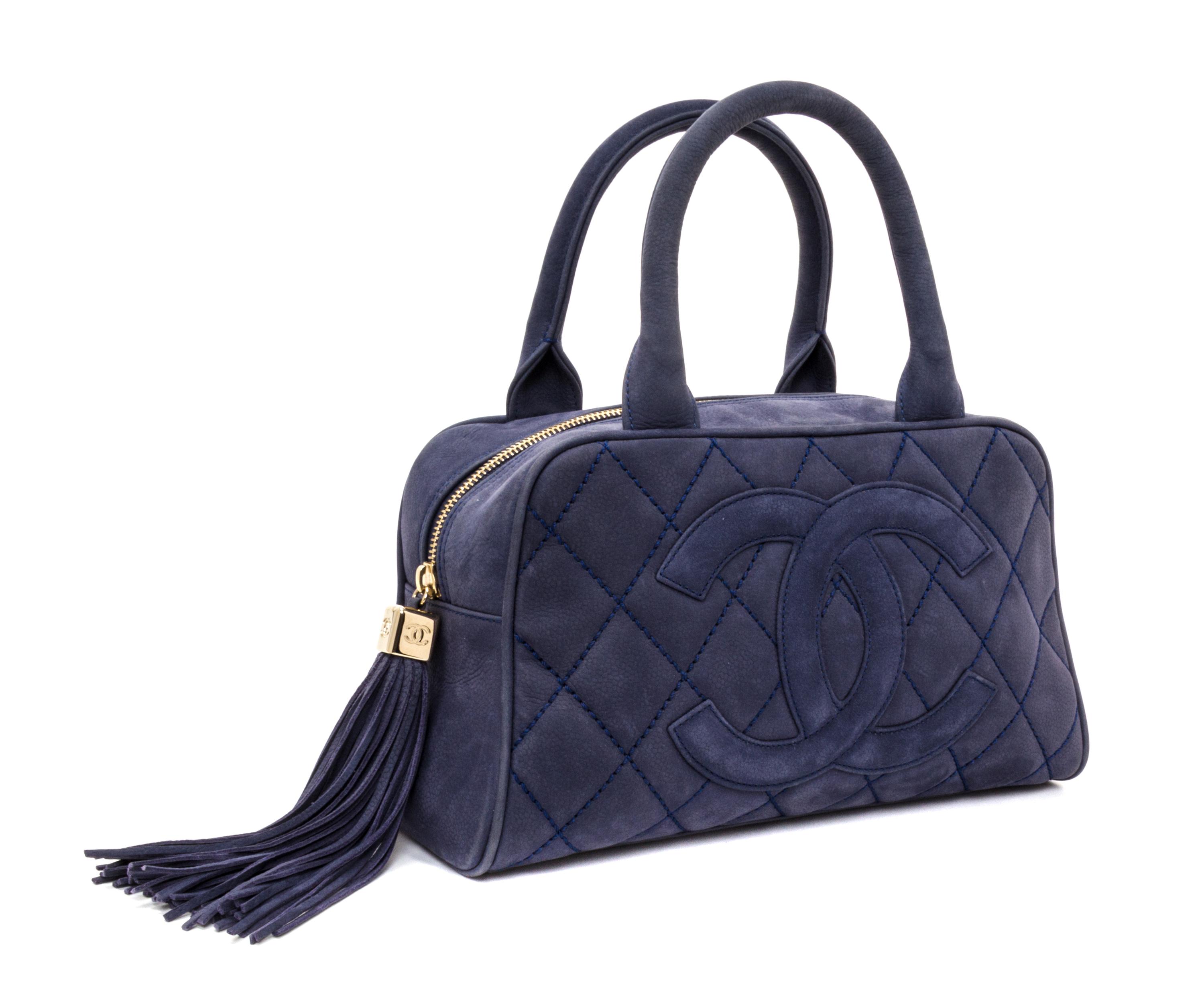 A Chanel Blue Suede Quilted Bowling Bag, 11" x 6.5" x 4.5".