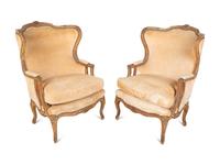 A Pair of Louis XV Style Giltwood Bergères a Oreilles — 19TH CENTURY