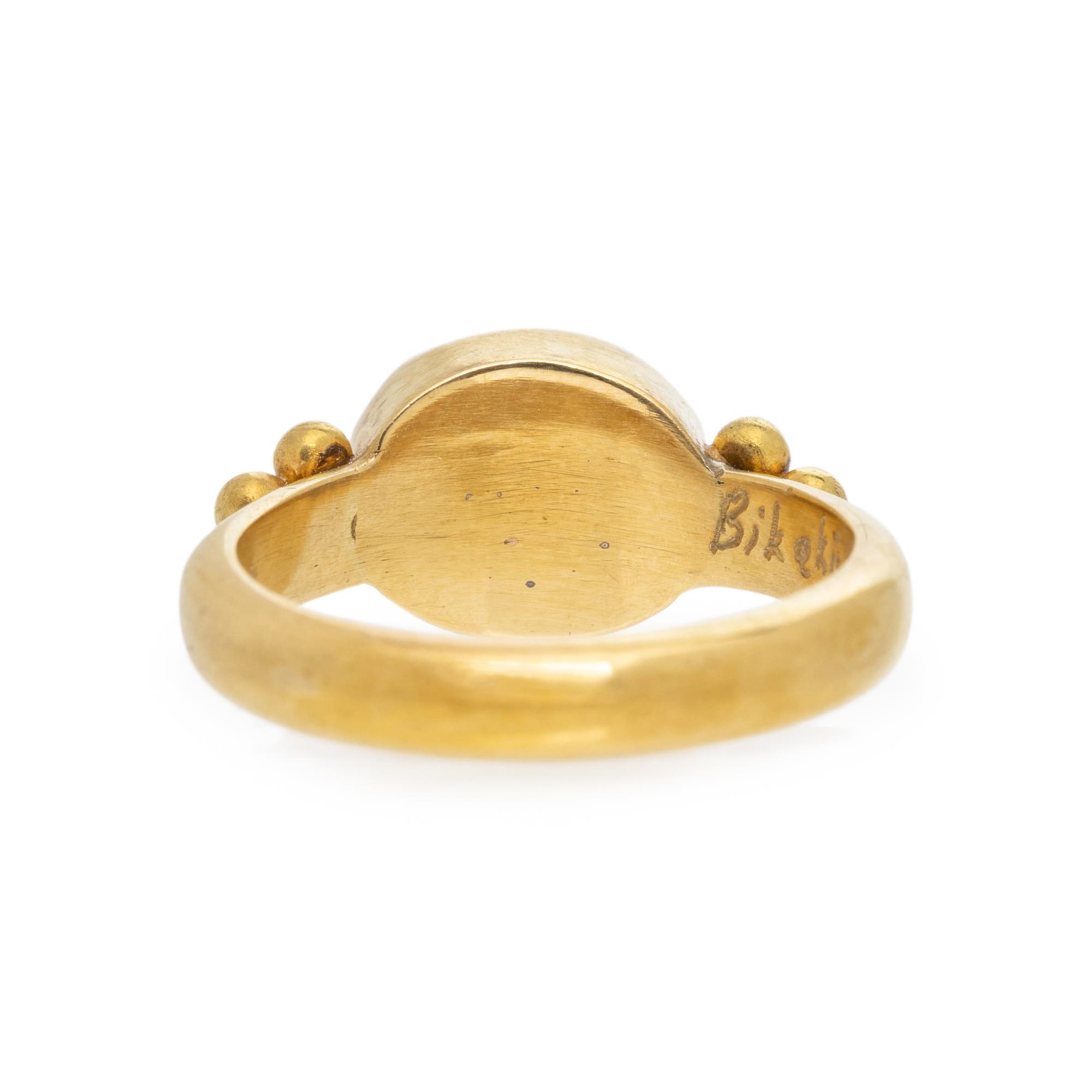BIKAKIS & JOHNS, HIGH KARAT YELLOW GOLD AND EMERALD RING