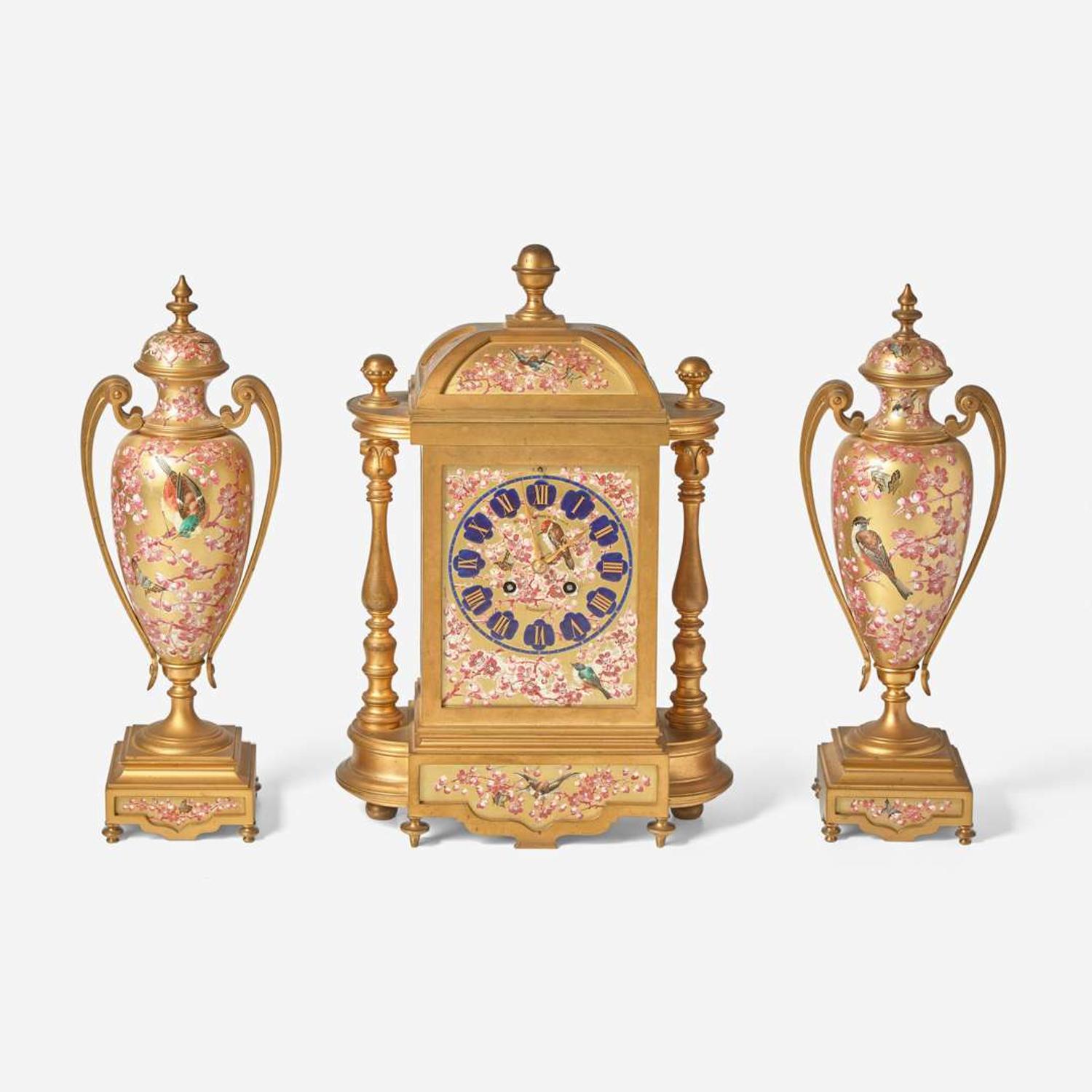 A French three-piece gilt bronze and enamel clock garniture Japy Frères, retailed by Bailey Banks & Biddle, Philadelphia, late 19th century
