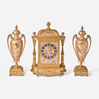 A French three-piece gilt bronze and enamel clock garniture Japy Frères, retailed by Bailey Banks & Biddle, Philadelphia, late 19th century