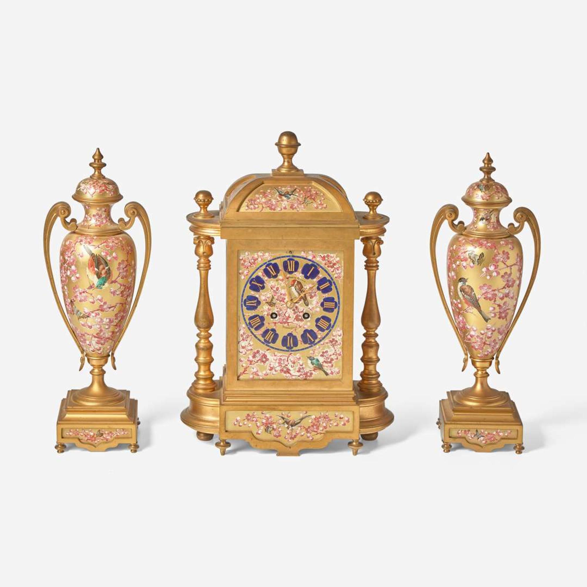 A French three-piece gilt bronze and enamel clock garniture Japy Frères, retailed by Bailey Banks & Biddle, Philadelphia, late 19th century