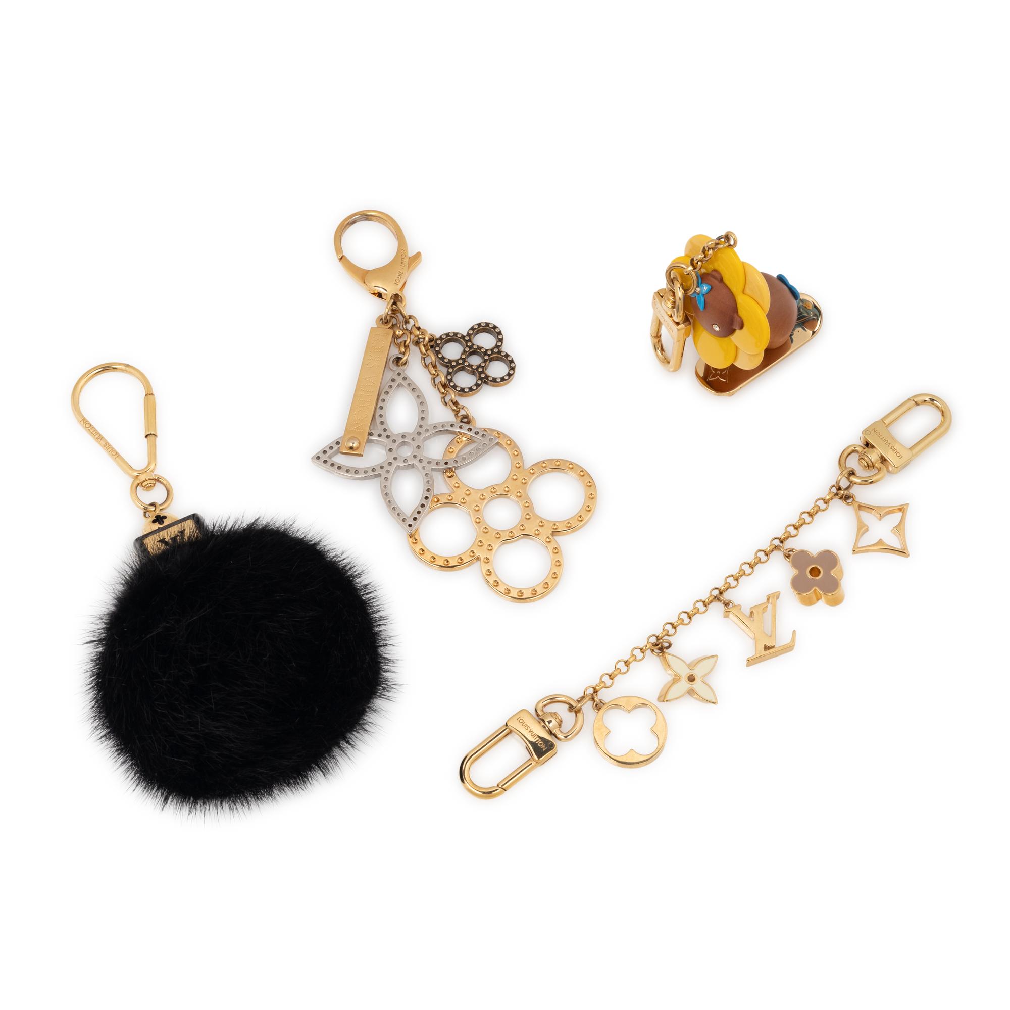 LOUIS VUITTON, GROUP OF FOUR BAG CHARMS