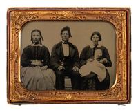 [EARLY PHOTOGRAPHY]. Half plate ambrotype of a family of four, acquired from Fort Smith, Arkansas.