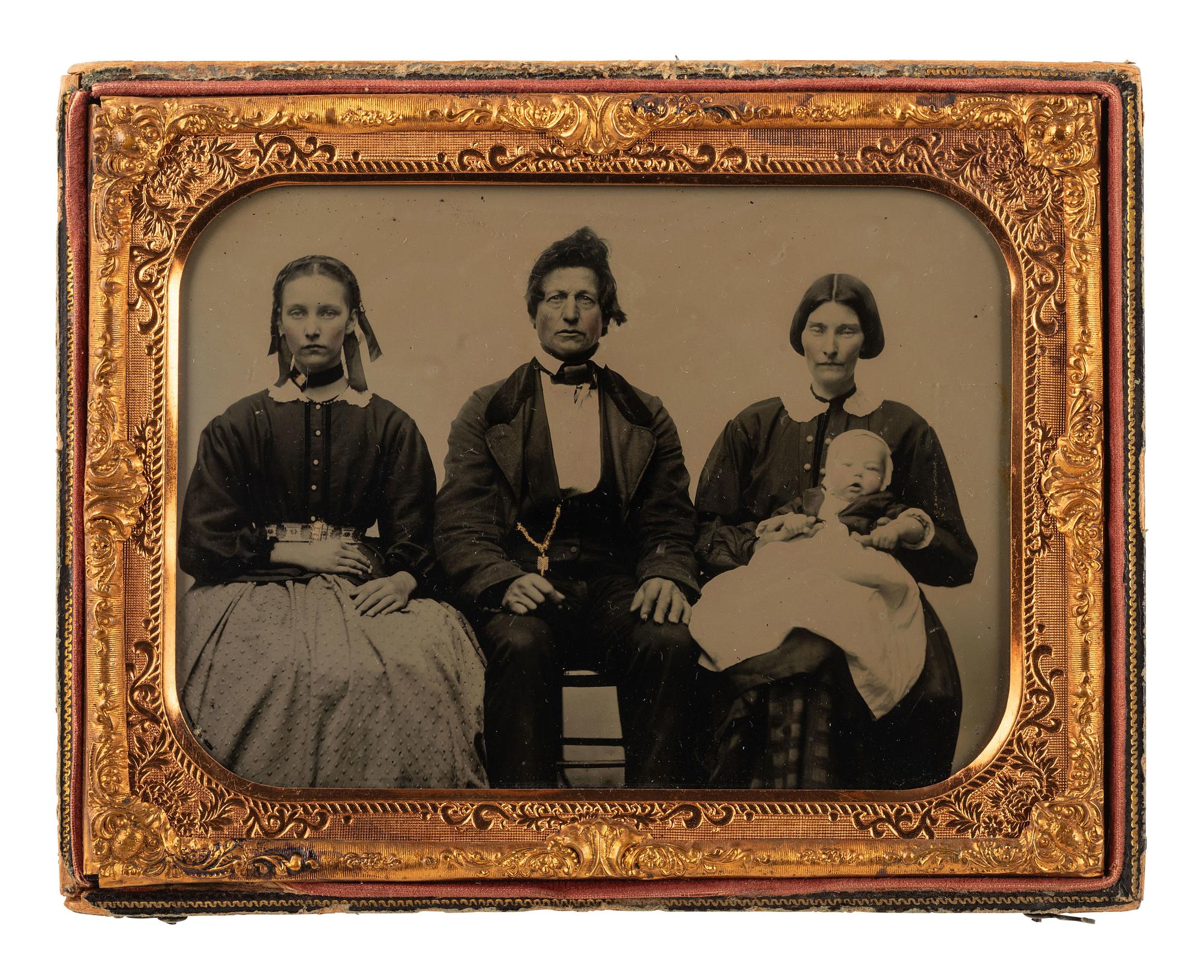 [EARLY PHOTOGRAPHY]. Half plate ambrotype of a family of four, acquired from Fort Smith, Arkansas.