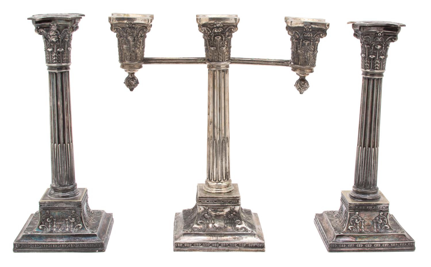 A Set of Three Wilcox Silver-Plate Candelabra, 20TH CENTURY, comprising a three-light candelabrum and two single candlesticks.