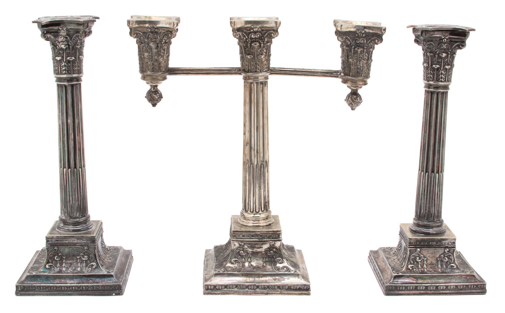 A Set of Three Wilcox Silver-Plate Candelabra, 20TH CENTURY, comprising a three-light candelabrum and two single candlesticks.