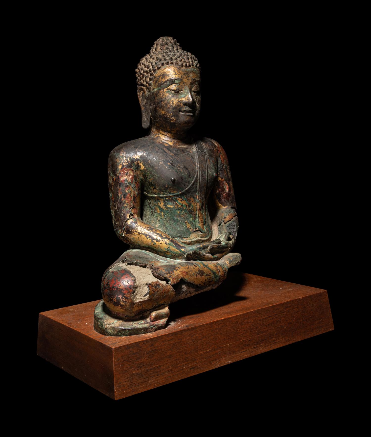 A Thai Gilt Decorated Bronze Figure of Seated Buddha